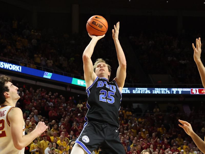 Mar 4, 2025; Ames, Iowa, USA; Brigham Young Cougars guard Dawson Baker (25) shoots in front of Iowa State Cyclones forward Milan Momcilovic (22) during the second half at James H. Hilton Coliseum. Mandatory Credit: Reese Strickland-Imagn Images