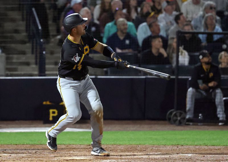 Mar 3, 2025; Tampa, Florida, USA;  Pittsburgh Pirates catcher Joey Bart (14) hits a two-run home run during the third inning  against the New York Yankees at George M. Steinbrenner Field. Mandatory Credit: Kim Klement Neitzel-Imagn Images