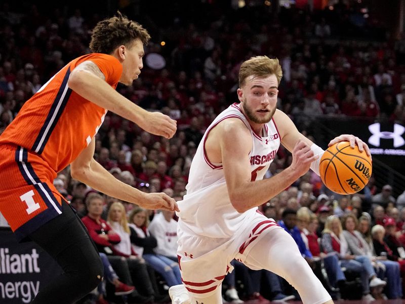 Mar 2, 2024; Madison, WI, USA;  Wisconsin forward Tyler Wahl (5) makes a move on Illinois forward Coleman Hawkins (33) during the second half of their game Saturday, March 2, 2024 at the Kohl Center in Madison, Wisconsin.  Mandatory Credit: Mark Hoffman-USA TODAY Sports
