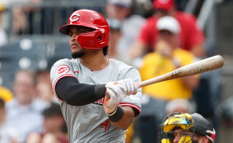 Aug 25, 2024; Pittsburgh, Pennsylvania, USA; Cincinnati Reds right fielder Santiago Espinal (4) hits a single against the Pittsburgh Pirates during the sixth inning at PNC Park. Mandatory Credit: Charles LeClaire-USA TODAY Sports