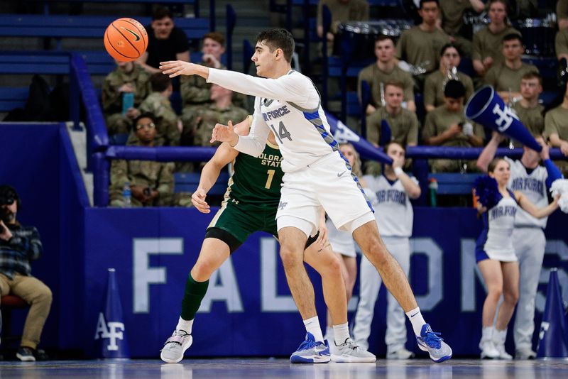 Mar 9, 2024; Colorado Springs, Colorado, USA; Air Force Falcons forward Beau Becker (14) passes the ball as Colorado State Rams forward Joel Scott (1) guards in the first half at Clune Arena. Mandatory Credit: Isaiah J. Downing-USA TODAY Sports