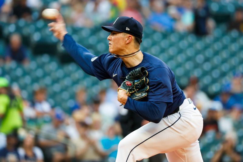 Aug 8, 2024; Seattle, Washington, USA; Seattle Mariners starting pitcher Bryan Woo (22) throws against the Detroit Tigers during the first inning at T-Mobile Park. Mandatory Credit: Joe Nicholson-USA TODAY Sports