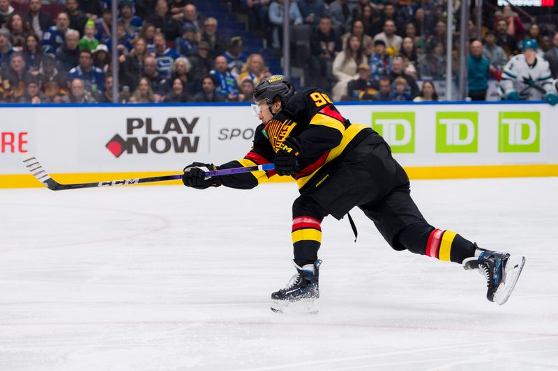 Dec 23, 2023; Vancouver, British Columbia, CAN; Vancouver Canucks forward Andrei Kuzmenko (96) scores against the San Jose Sharks in the first period at Rogers Arena. Mandatory Credit: Bob Frid-USA TODAY Sports