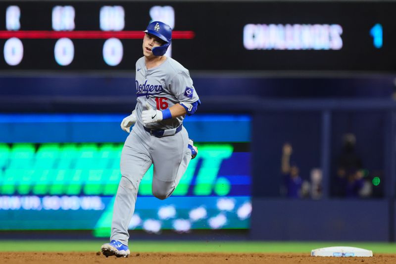 Sep 18, 2024; Miami, Florida, USA; Los Angeles Dodgers catcher Will Smith (16) circles the bases after hitting a solo home run. against the Miami Marlins during the second inning at loanDepot Park. Mandatory Credit: Sam Navarro-Imagn Images