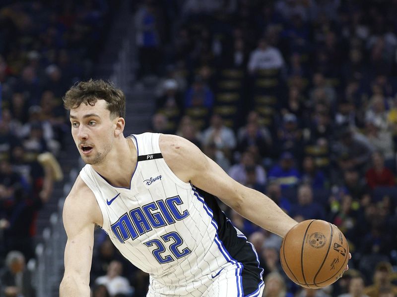 SAN FRANCISCO, CALIFORNIA - FEBRUARY 03: Franz Wagner #22 of the Orlando Magic dribbles the ball against the Golden State Warriors during the first half of an NBA basketball game at Chase Center on February 03, 2025 in San Francisco, California. NOTE TO USER: User expressly acknowledges and agrees that, by downloading and or using this photograph, User is consenting to the terms and conditions of the Getty Images License Agreement.  (Photo by Thearon W. Henderson/Getty Images)