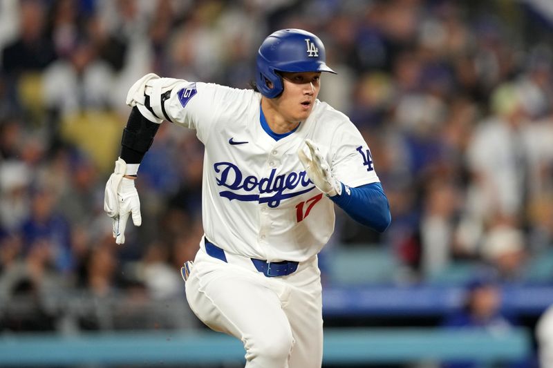 May 21, 2024; Los Angeles, California, USA; Los Angeles Dodgers designated hitter Shohei Ohtani (17) runs the bases on a double in the fourth inning against the Arizona Diamondbacks at Dodger Stadium. Mandatory Credit: Kirby Lee-USA TODAY Sports