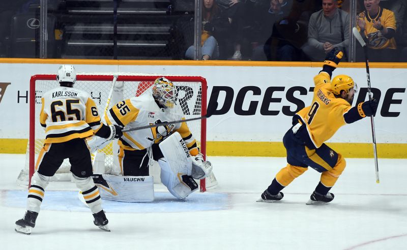 Nov 28, 2023; Nashville, Tennessee, USA; Nashville Predators left wing Filip Forsberg (9) scores the game-winning goal against Pittsburgh Penguins goaltender Tristan Jarry (35) in overtime at Bridgestone Arena. Mandatory Credit: Christopher Hanewinckel-USA TODAY Sports