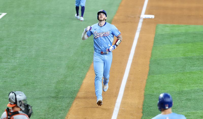 Jul 21, 2024; Arlington, Texas, USA; Texas Rangers catcher Jonah Heim (28) reacts after hitting a three run home run during the fourth inning against the Baltimore Orioles at Globe Life Field. Mandatory Credit: Kevin Jairaj-USA TODAY Sports