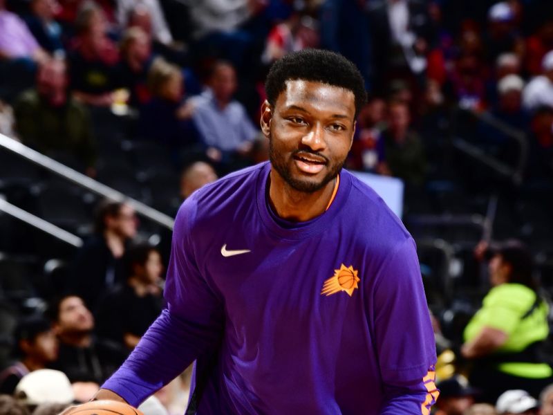 PHOENIX, AZ - JANUARY 22: Chimezie Metu #4 of the Phoenix Suns warms up before the game against the Chicago Bulls on January 22, 2024 at Footprint Center in Phoenix, Arizona. NOTE TO USER: User expressly acknowledges and agrees that, by downloading and or using this photograph, user is consenting to the terms and conditions of the Getty Images License Agreement. Mandatory Copyright Notice: Copyright 2024 NBAE (Photo by Barry Gossage/NBAE via Getty Images)