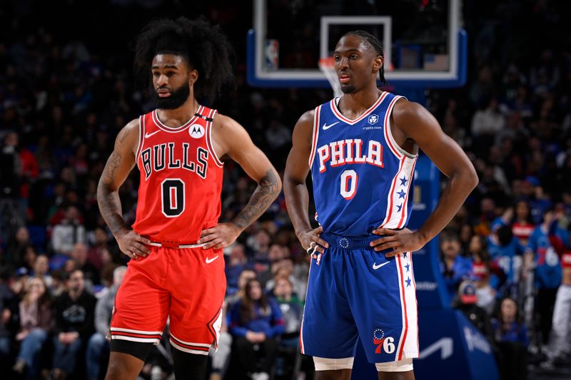 PHILADELPHIA, PA - FEBRUARY 24:  Coby White #0 of the Chicago Bulls and Tyrese Maxey #0 of the Philadelphia 76ers looks on during the game on February 24, 2025 at the Wells Fargo Center in Philadelphia, Pennsylvania NOTE TO USER: User expressly acknowledges and agrees that, by downloading and/or using this Photograph, user is consenting to the terms and conditions of the Getty Images License Agreement. Mandatory Copyright Notice: Copyright 2025 NBAE (Photo by David Dow/NBAE via Getty Images)