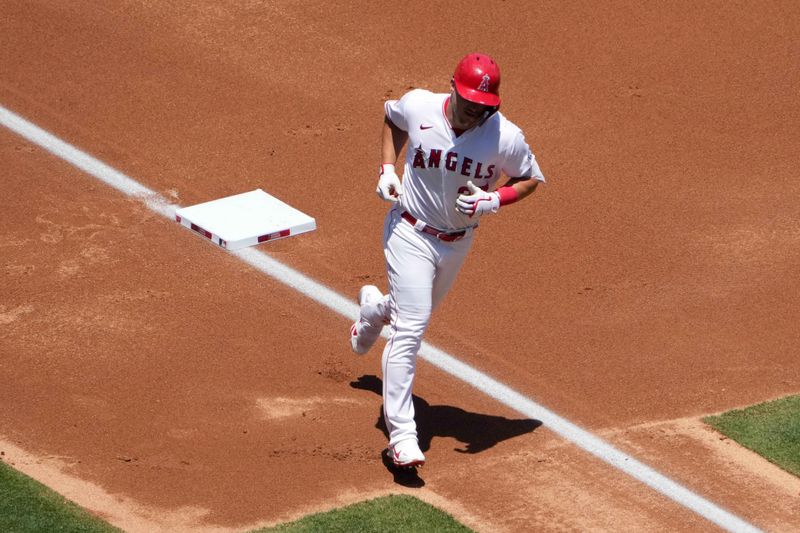 Jul 2, 2023; Anaheim, California, USA; Los Angeles Angels center fielder Mike Trout (27) runs the bases after hitting a solo home run in the first inning against the Arizona Diamondbacks at Angel Stadium. Mandatory Credit: Kirby Lee-USA TODAY Sports