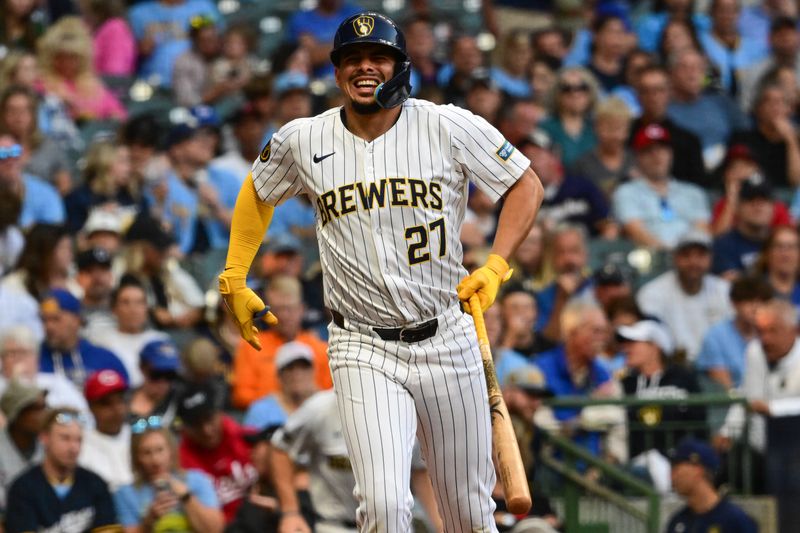 Aug 10, 2024; Milwaukee, Wisconsin, USA; Milwaukee Brewers shortstop Willy Adames (27) reacts after hitting a foul ball off his leg in the fifth inning against the Cincinnati Reds at American Family Field. Mandatory Credit: Benny Sieu-USA TODAY Sports