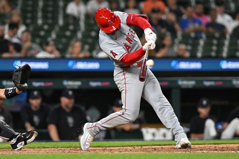 Aug 27, 2024; Detroit, Michigan, USA; Los Angeles Angels left fielder Taylor Ward (3) hits a sacrifice fly against the Detroit Tigers in the fifth inning at Comerica Park. Mandatory Credit: Lon Horwedel-USA TODAY Sports