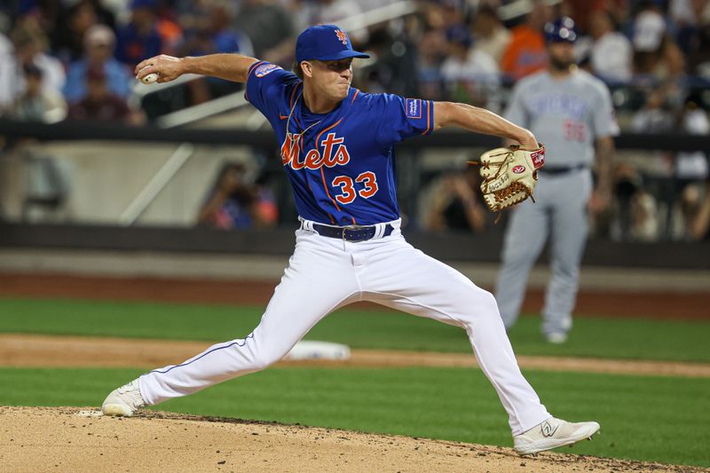 Aug 8, 2023; New York City, New York, USA; New York Mets relief pitcher Trevor Gott (33) delivers a pitch during the seventh inning against the Chicago Cubs at Citi Field. Mandatory Credit: Vincent Carchietta-USA TODAY Sports