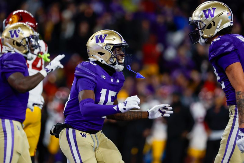 Nov 2, 2024; Seattle, Washington, USA; Washington Huskies wide receiver Keith Reynolds (15) celebrates after rushing for a touchdown against the USC Trojans during the fourth quarter at Alaska Airlines Field at Husky Stadium. Mandatory Credit: Joe Nicholson-Imagn Images