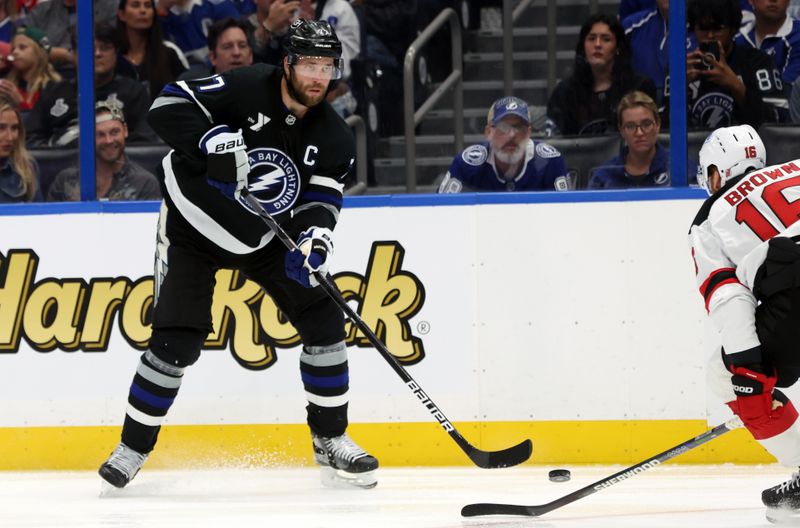 Oct 11, 2025; Tampa, Florida, USA; Tampa Bay Lightning defenseman Victor Hedman (77) passes the puck against the New Jersey Devils during the third period at Benchmark International Arena. Mandatory Credit: Kim Klement Neitzel-Imagn Images
