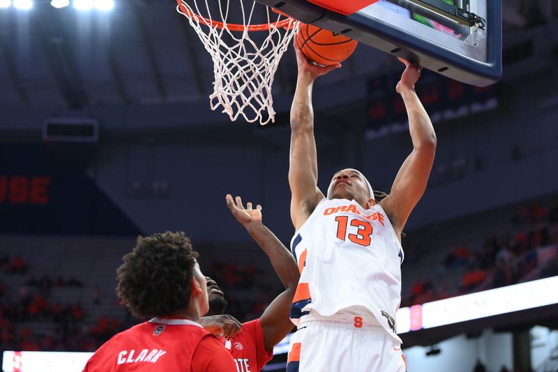 Feb 14, 2023; Syracuse, New York, USA; Syracuse Orange forward Benny Williams (13) shoots the ball against the North Carolina State Wolfpack during the first half at the JMA Wireless Dome. Mandatory Credit: Rich Barnes-USA TODAY Sports