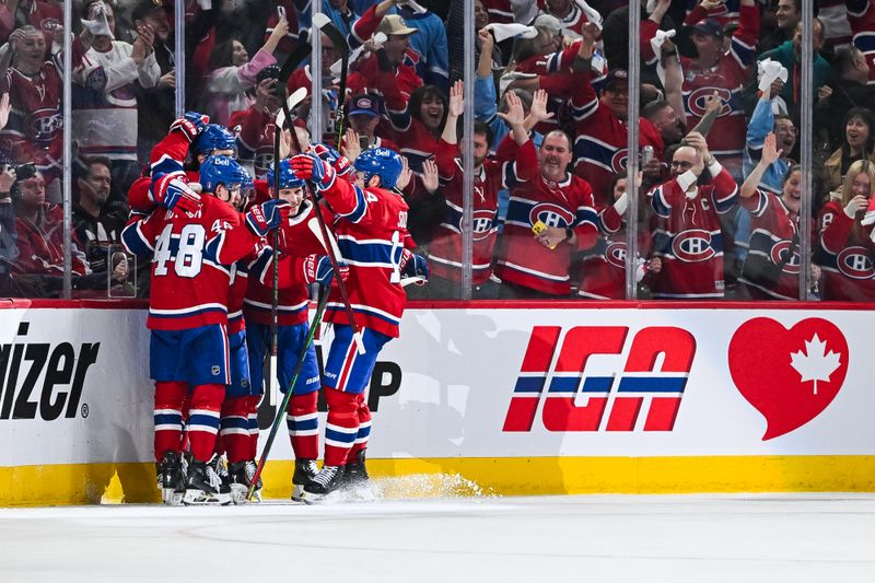 Apr 27, 2025; Montreal, Quebec, CAN; Montreal Canadiens left wing Juraj Slafkovsky (20) celebrates with his teammates his goal against the Washington Capitals during the second period in game four of the first round of the 2025 Stanley Cup Playoffs at Bell Centre. Mandatory Credit: David Kirouac-Imagn Images