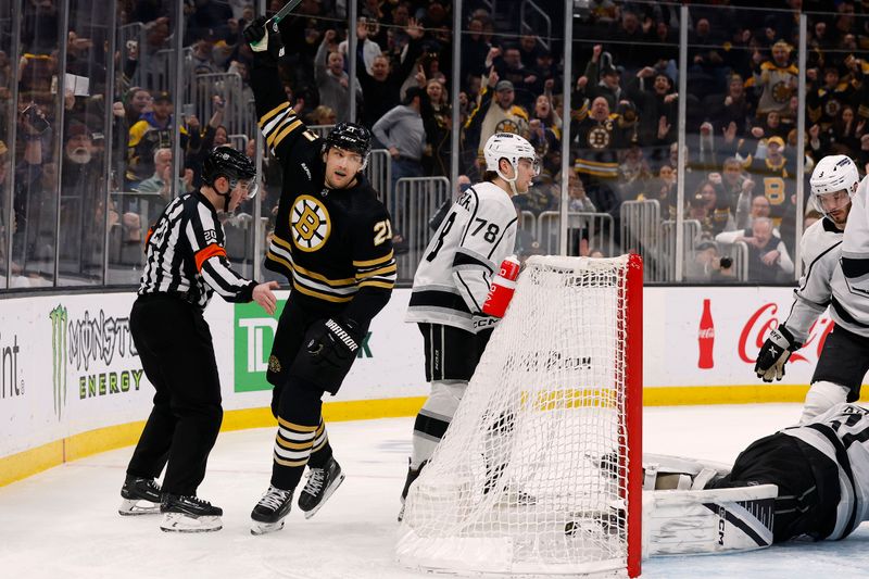 Feb 17, 2024; Boston, Massachusetts, USA; Boston Bruins left wing James van Riemsdyk (21) celebrates the first of his two goals during the first period as Los Angeles Kings right wing Alex Laferriere (78) skates away at TD Garden. Mandatory Credit: Winslow Townson-USA TODAY Sports
