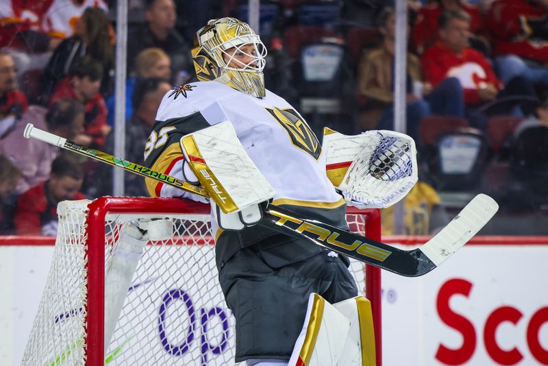 Mar 14, 2024; Calgary, Alberta, CAN; Vegas Golden Knights goaltender Adin Hill (33) during the second period against the Calgary Flames at Scotiabank Saddledome. Mandatory Credit: Sergei Belski-USA TODAY Sports