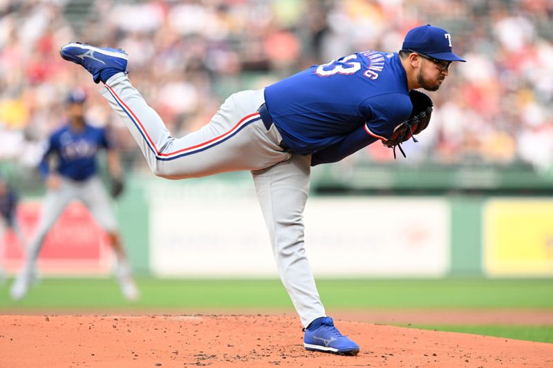 Aug 14, 2024; Boston, Massachusetts, USA; Texas Rangers starting pitcher Dane Dunning (33) pitches against the Boston Red Sox during the first inning at Fenway Park. Mandatory Credit: Brian Fluharty-USA TODAY Sports