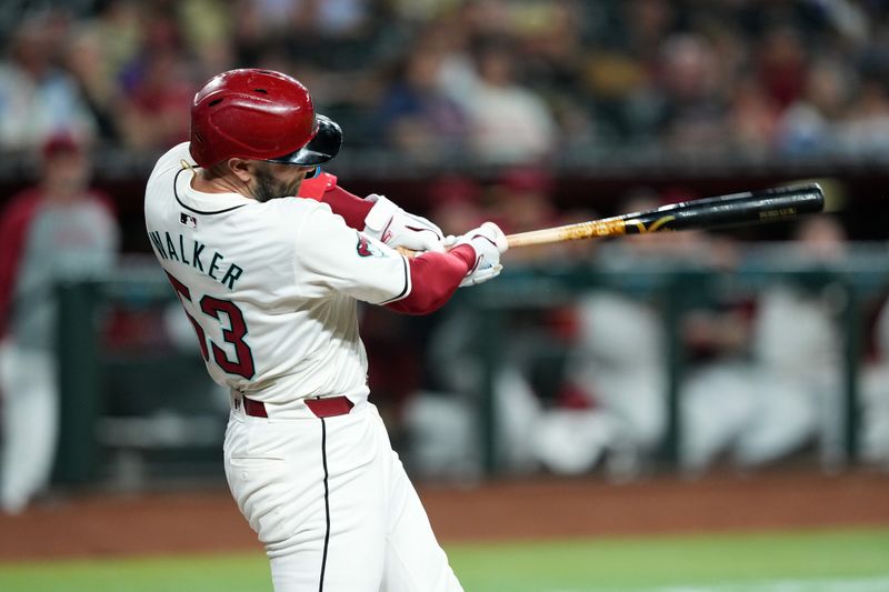 Jun 13, 2024; Phoenix, Arizona, USA; Arizona Diamondbacks first base Christian Walker (53) hits a three run home run against the Los Angeles Angels during the first inning at Chase Field. Mandatory Credit: Joe Camporeale-USA TODAY Sports