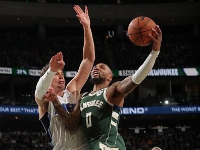 MILWAUKEE, WI - DECEMBER 21:  Damian Lillard #0 of the Milwaukee Bucks drives to the basket during the game against the Orlando Magic on December 21, 2023 at the Fiserv Forum Center in Milwaukee, Wisconsin. NOTE TO USER: User expressly acknowledges and agrees that, by downloading and or using this Photograph, user is consenting to the terms and conditions of the Getty Images License Agreement. Mandatory Copyright Notice: Copyright 2023 NBAE (Photo by Gary Dineen/NBAE via Getty Images).