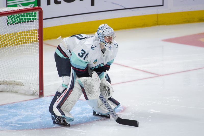 Nov 2, 2024; Ottawa, Ontario, CAN; Seattle Kraken goalie Philipp Grubauer (31) sets up for the face off to start the third period against the Ottawa Senators at the Canadian Tire Centre. Mandatory Credit: Marc DesRosiers-Imagn Images