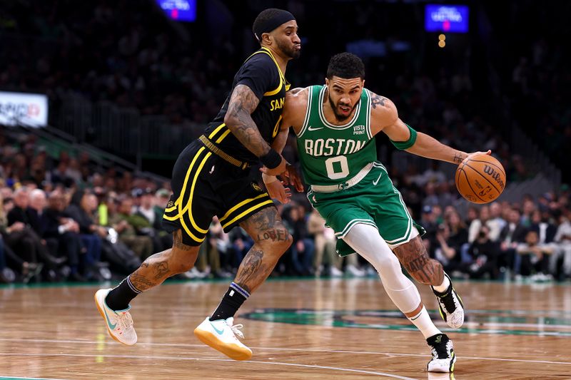 BOSTON, MASSACHUSETTS - MARCH 03: Jayson Tatum #0 of the Boston Celtics drives towards the basket against Gary Payton II #0 of the Golden State Warriors during the first quarter at TD Garden on March 03, 2024 in Boston, Massachusetts. NOTE TO USER: User expressly acknowledges and agrees that, by downloading and or using this photograph, user is consenting to the terms and conditions of the Getty Images License Agreement.  (Photo by Maddie Meyer/Getty Images)