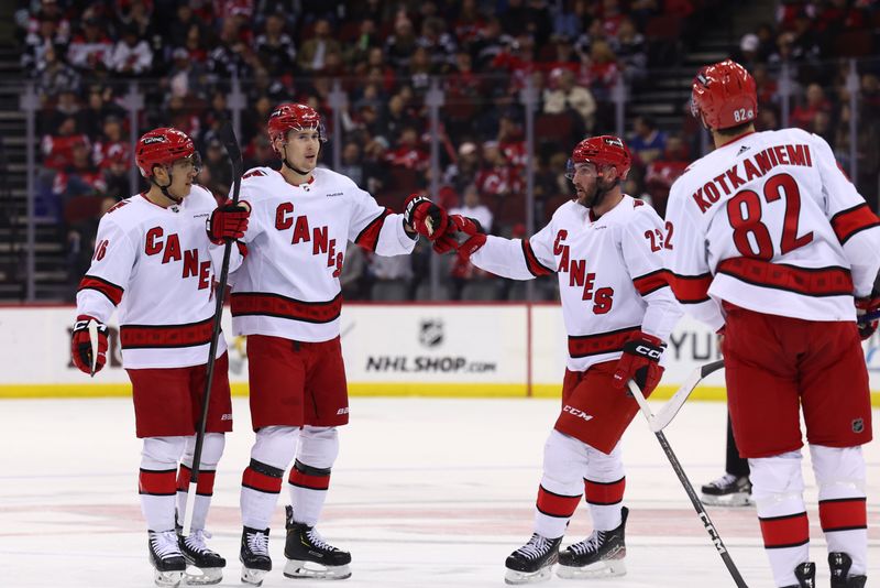 Mar 9, 2024; Newark, New Jersey, USA; Carolina Hurricanes center Martin Necas (88) celebrates his goal against the New Jersey Devils during the first period at Prudential Center. Mandatory Credit: Ed Mulholland-USA TODAY Sports