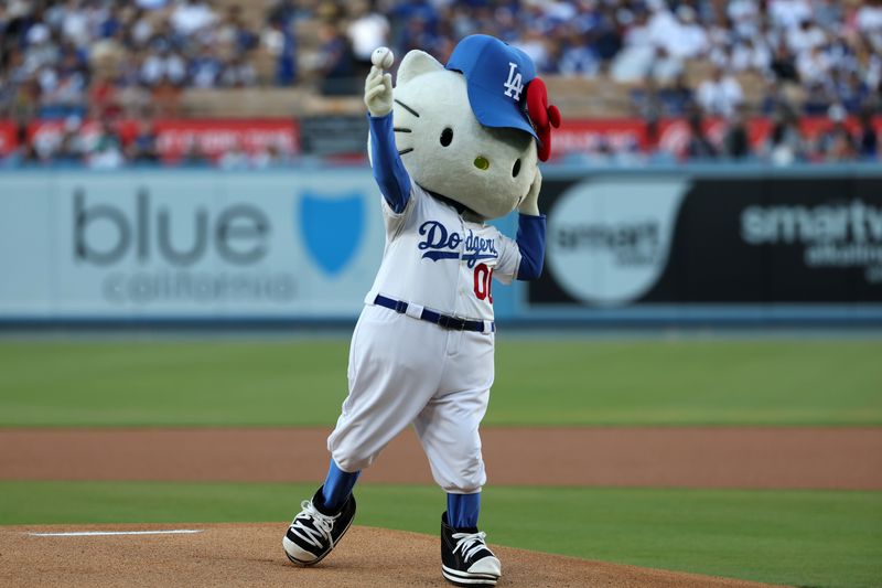 Aug 3, 2023; Los Angeles, California, USA;  Hello Kitty throws the ceremonial first pitch before a game between the Oakland Athletics and the Los Angeles Dodgers at Dodger Stadium. Mandatory Credit: Kiyoshi Mio-USA TODAY Sports