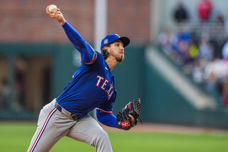 Apr 21, 2024; Cumberland, Georgia, USA; Texas Rangers starting pitcher Michael Lorenzen (23) pitches against the Atlanta Braves during the first inning at Truist Park. Mandatory Credit: Dale Zanine-USA TODAY Sports