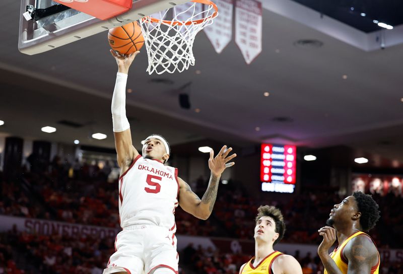 Jan 6, 2024; Norman, Oklahoma, USA; Oklahoma Sooners guard Rivaldo Soares (5) shoots against the Iowa State Cyclones during the second half at Lloyd Noble Center. Mandatory Credit: Alonzo Adams-USA TODAY Sports