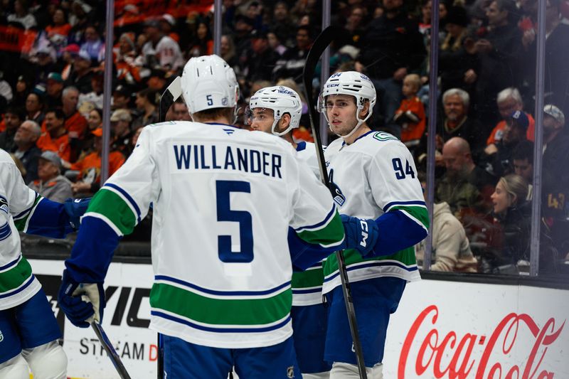 Nov 26, 2025; Anaheim, California, USA; Vancouver Canucks center Linus Karlsson (94) celebrates with teammates after scoring a goal during the first period against the Anaheim Ducks at Honda Center. Mandatory Credit: William Liang-Imagn Images