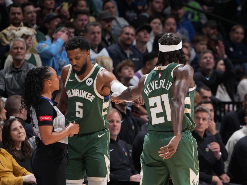 MINNEAPOLIS, MN -  FEBRUARY 23: Malik Beasley #5  and Patrick Beverley #21 of the Milwaukee Bucks high five during the game against the Minnesota Timberwolves  on February 23, 2024 at Target Center in Minneapolis, Minnesota. NOTE TO USER: User expressly acknowledges and agrees that, by downloading and or using this Photograph, user is consenting to the terms and conditions of the Getty Images License Agreement. Mandatory Copyright Notice: Copyright 2024 NBAE (Photo by Jordan Johnson/NBAE via Getty Images)