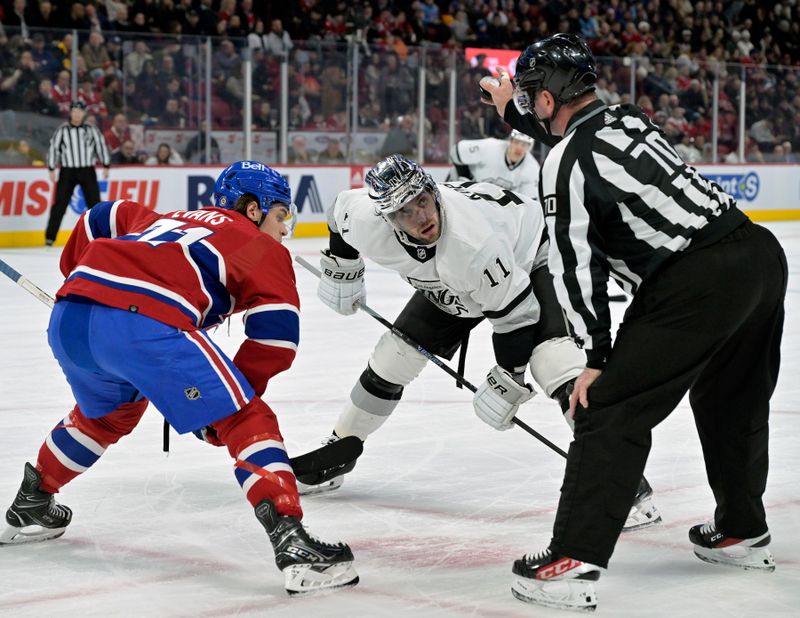 Dec 7, 2023; Montreal, Quebec, CAN; Montreal Canadiens forward Jake Evans (71) and Los Angeles Kings forward Anze Kopitar (11) listen to instructions from linesman Derek Nansen (70) during the first period at the Bell Centre. Mandatory Credit: Eric Bolte-USA TODAY Sports