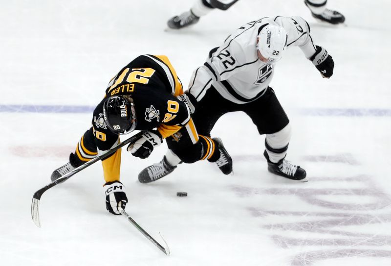 Feb 18, 2024; Pittsburgh, Pennsylvania, USA;  Los Angeles Kings left wing Kevin Fiala (22) knocks Pittsburgh Penguins center Lars Eller (20) off of the puck during the second period at PPG Paints Arena. Los Angeles won 2-1.  Mandatory Credit: Charles LeClaire-USA TODAY Sports