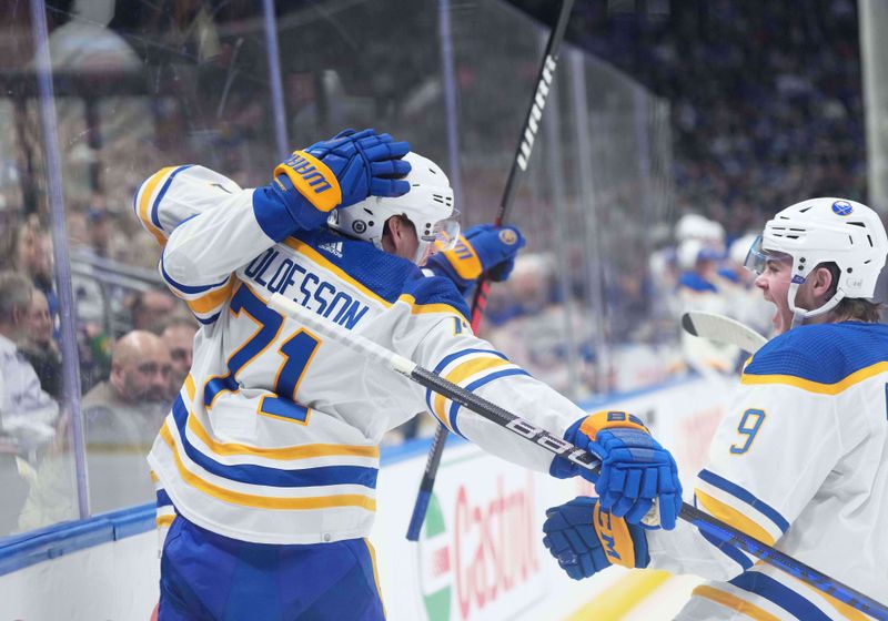 Mar 6, 2024; Toronto, Ontario, CAN; Buffalo Sabres left wing Victor Olofsson (71) scores a goal and celebrates with Buffalo Sabres left wing Zach Benson (9) against the Toronto Maple Leafs during the second period at Scotiabank Arena. Mandatory Credit: Nick Turchiaro-USA TODAY Sports