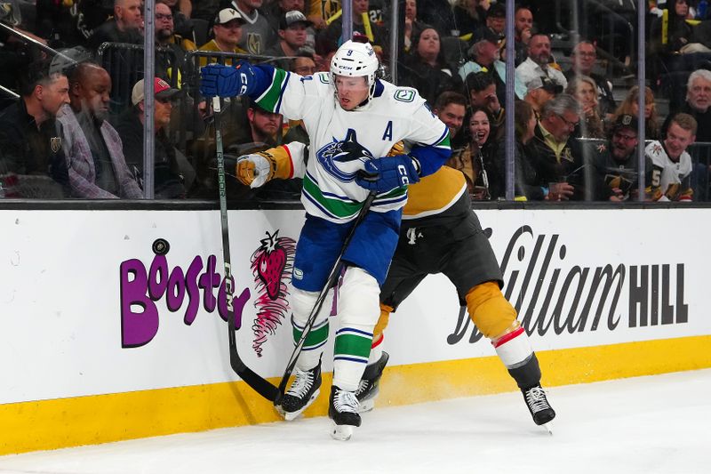 Apr 2, 2024; Las Vegas, Nevada, USA; Vegas Golden Knights defenseman Alex Pietrangelo (7) checks Vancouver Canucks center J.T. Miller (9) off the puck during the second period at T-Mobile Arena. Mandatory Credit: Stephen R. Sylvanie-USA TODAY Sports