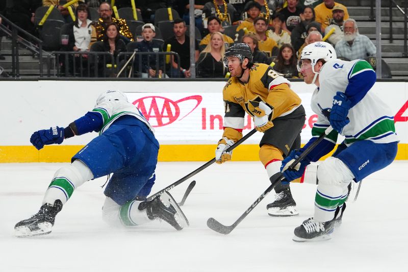 Apr 2, 2024; Las Vegas, Nevada, USA; Vegas Golden Knights right wing Jonathan Marchessault (81) scores on a shot against the Vancouver Canucks during the first period at T-Mobile Arena. Mandatory Credit: Stephen R. Sylvanie-USA TODAY Sports