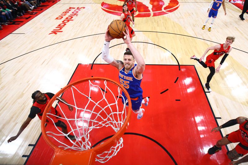 TORONTO, CANADA - MARCH 27: Isaiah Hartenstein #55 of the New York Knicks dunks the ball during the game against the Toronto Raptors on March 27, 2024 at the Scotiabank Arena in Toronto, Ontario, Canada.  NOTE TO USER: User expressly acknowledges and agrees that, by downloading and or using this Photograph, user is consenting to the terms and conditions of the Getty Images License Agreement.  Mandatory Copyright Notice: Copyright 2024 NBAE (Photo by Vaughn Ridley/NBAE via Getty Images)