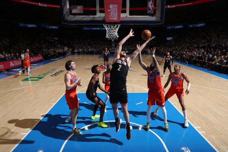 OKLAHOMA CITY, OK - MARCH 27:  Jock Landale #2 of the Houston Rockets grabs a rebound during the game against the Oklahoma City Thunder on March 27, 2024 at Paycom Arena in Oklahoma City, Oklahoma. NOTE TO USER: User expressly acknowledges and agrees that, by downloading and or using this photograph, User is consenting to the terms and conditions of the Getty Images License Agreement. Mandatory Copyright Notice: Copyright 2024 NBAE (Photo by Zach Beeker/NBAE via Getty Images)