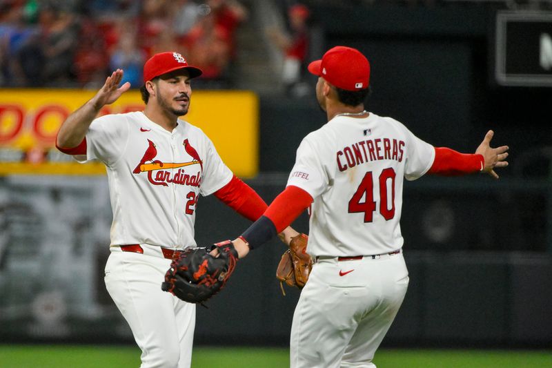 Jun 24, 2025; St. Louis, Missouri, USA;  St. Louis Cardinals third baseman Nolan Arenado (28) celebrates with first baseman Willson Contreras (40) after the Cardinals defeated the Chicago Cubs at Busch Stadium. Mandatory Credit: Jeff Curry-Imagn Images