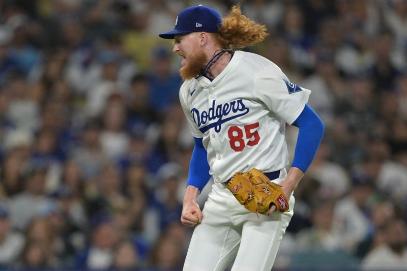May 21, 2025; Los Angeles, California, USA; Los Angeles Dodgers starting pitcher Dustin May (85) reacts after striking out Arizona Diamondbacks first baseman Pavin Smith (26) to end the sixth inning at Dodger Stadium. Mandatory Credit: Jayne Kamin-Oncea-Imagn Images