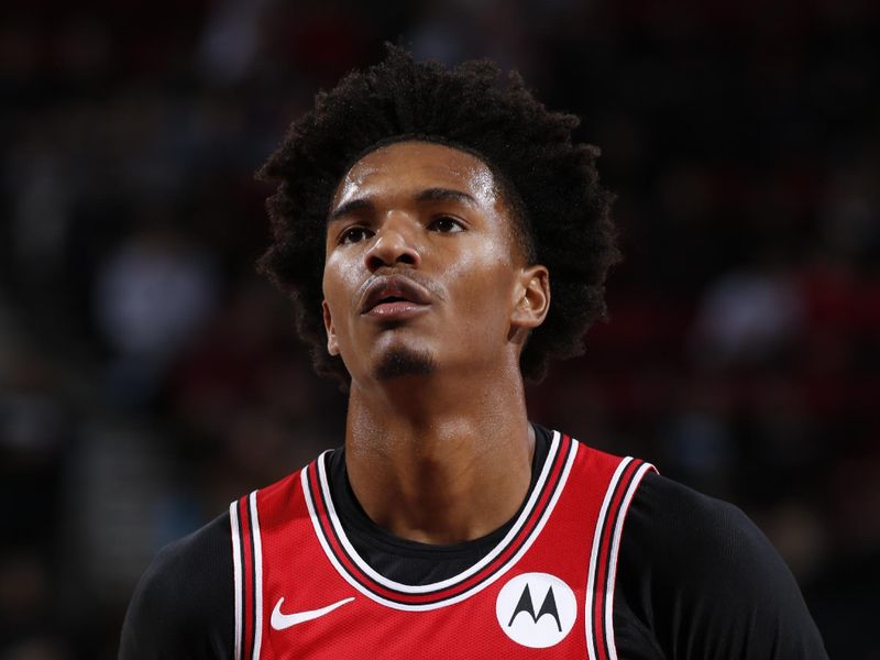 PORTLAND, OR - JANUARY 28: Julian Phillips #15 of the Chicago Bulls prepares to shoot a free throw during the game against the Portland Trail Blazers on January 28, 2024 at the Moda Center Arena in Portland, Oregon. NOTE TO USER: User expressly acknowledges and agrees that, by downloading and or using this photograph, user is consenting to the terms and conditions of the Getty Images License Agreement. Mandatory Copyright Notice: Copyright 2024 NBAE (Photo by Cameron Browne/NBAE via Getty Images)