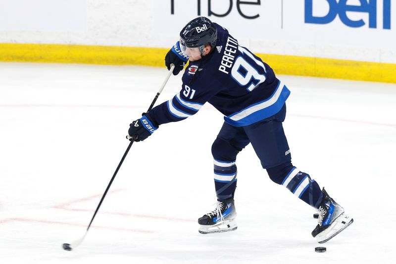 Apr 30, 2024; Winnipeg, Manitoba, CAN; Winnipeg Jets center Cole Perfetti (91) warms up before the game against the Colorado Avalanche in game five of the first round of the 2024 Stanley Cup Playoffs at Canada Life Centre. Mandatory Credit: James Carey Lauder-USA TODAY Sports