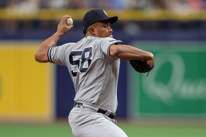 Aug 27, 2023; St. Petersburg, Florida, USA;  New York Yankees relief pitcher Wandy Peralta (58) throws a pitch against the Tampa Bay Rays in the sixth inning at Tropicana Field. Mandatory Credit: Nathan Ray Seebeck-USA TODAY Sports