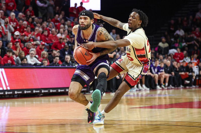 Feb 15, 2024; Piscataway, New Jersey, USA; Northwestern Wildcats guard Boo Buie (0) is fouled by Rutgers Scarlet Knights guard Jeremiah Williams (25) during the first half at Jersey Mike's Arena. Mandatory Credit: Vincent Carchietta-USA TODAY Sports