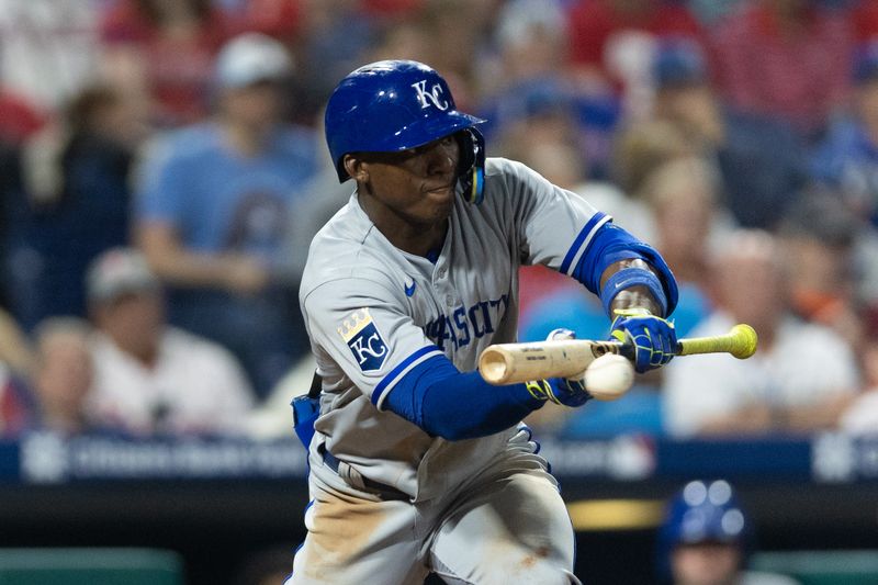 Aug 4, 2023; Philadelphia, Pennsylvania, USA; Kansas City Royals left fielder Dairon Blanco (44) bunts for an RBI during the eighth inning against the Philadelphia Phillies at Citizens Bank Park. Mandatory Credit: Bill Streicher-USA TODAY Sports