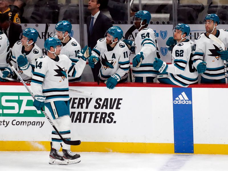 Mar 14, 2024; Pittsburgh, Pennsylvania, USA; San Jose Sharks defenseman Marc-Edouard Vlasic (44) celebrates with the Sharks bench after scoring a goal against the Pittsburgh Penguins during the first period at PPG Paints Arena. Mandatory Credit: Charles LeClaire-USA TODAY Sports